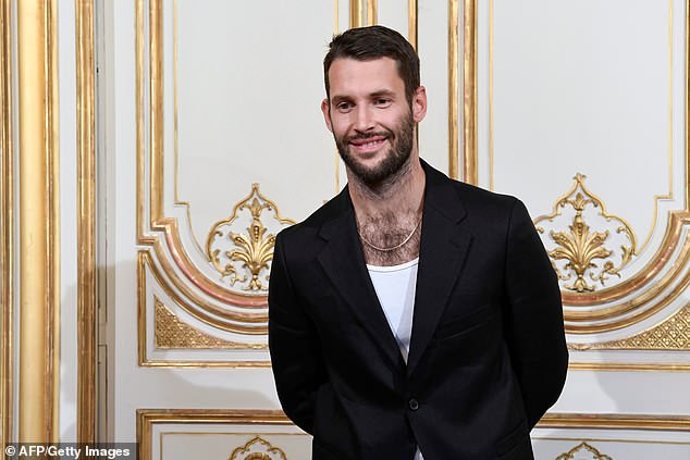4561002-6209797-French_designer_Simon_Porte_Jacquemus_has_become_the_toast_of_th-a-1_1538056067465.jpg